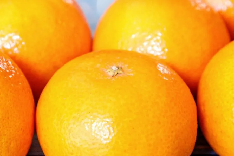  Oranges all together on a table.